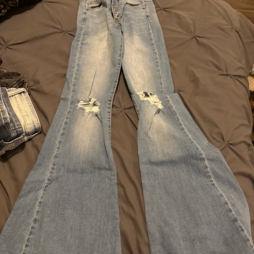 Light Blue Flare Wide Leg Jeans with Distressing and Fading